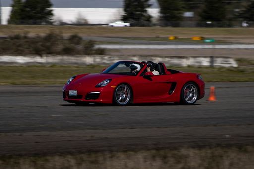 A Red Porsche car racing on a runway in Washington