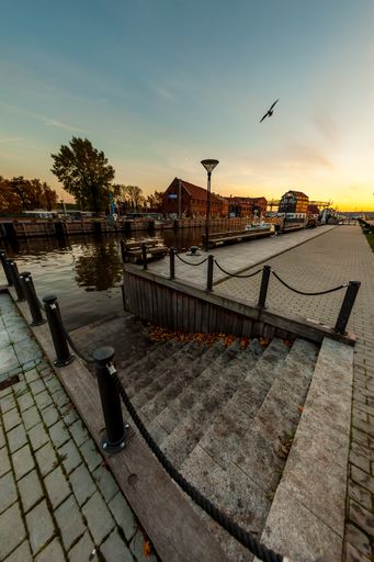 A vertical shot of stairs leading to the river in Klaipeda Old Town, Lithuania