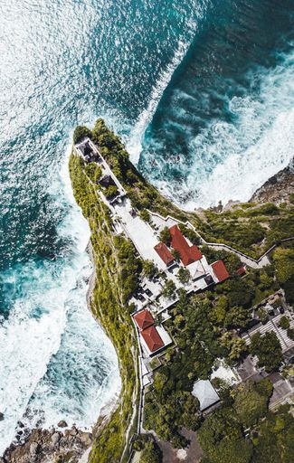 A drone shot of Uluwatu temple in the island of Bali in Indonesia