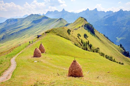 Hay stacks along a ridge walk in the Swiss Alps near between Klingenstock and Fronalpstock with  impressive views on Lake Lucerne