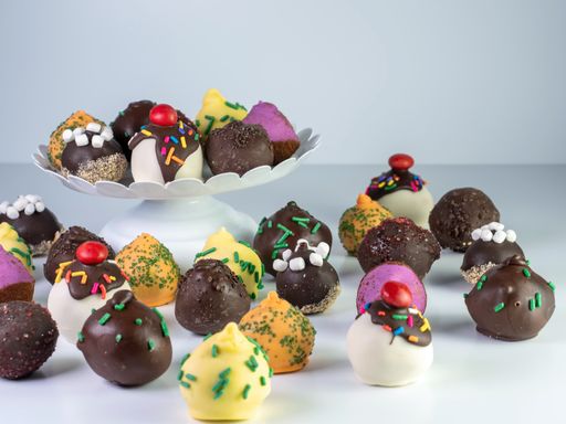 An assortment of chocolate balls  with a withe background