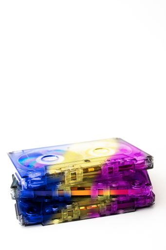 The vintage colorful music cassette tapes in the white background- turning back to 90's