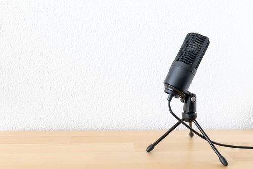 A typical microphone isolated on white background