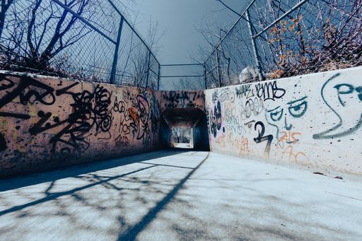 A beautiful shot of a street corner with graffiti covered walls