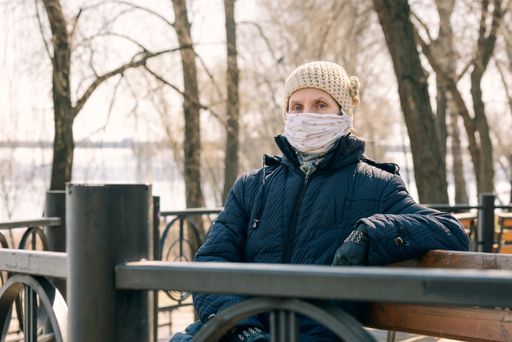 A poor elderly woman wears a homemade mask to protect herself from viruses such as coronavirus, also known as covid-19, or SARS and MERS.