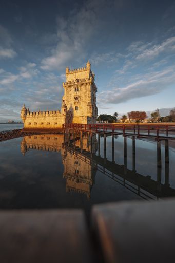 A vertical shot of Belem tower on the northern bank of the Tagus River, Lisbon, on a warm spring day