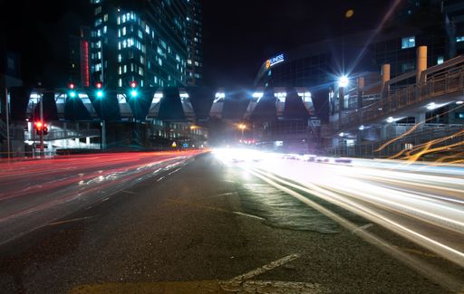 A light trail on the road in the city at night