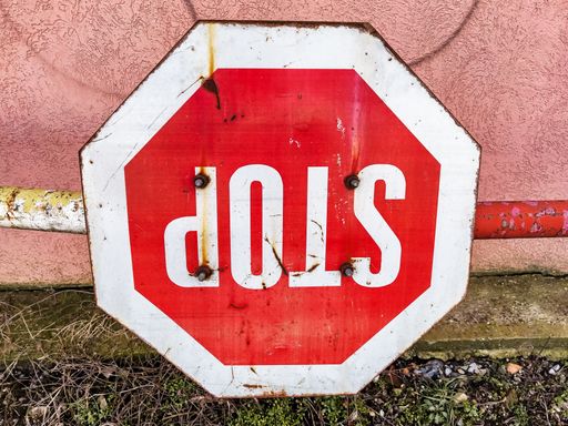 A closeup of an upside-down stop sign