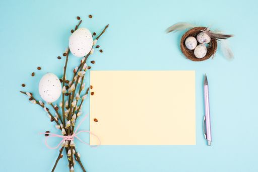 Easter holiday and spring background, empty paper for text, pastel colors, nest with eggs, pussy willow, greeting card