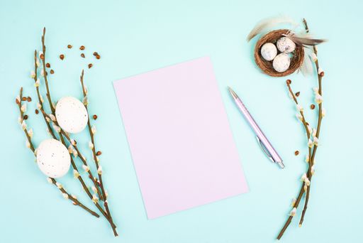 Easter holiday and spring background, empty paper for text, pastel colors, nest with eggs, pussy willow, greeting card