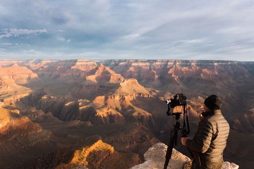 A man taking a shot of the amazing grand canyon in Arizona