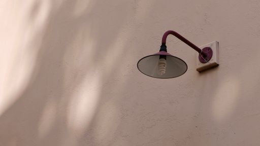 An old street lamp on the wall