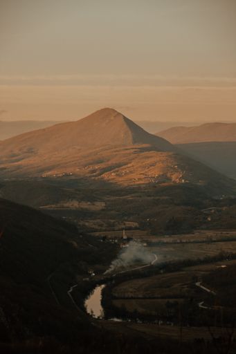A vertical shot of a rural area with sand hills