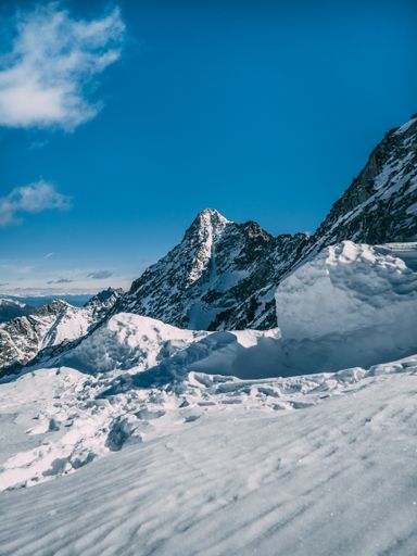 A vertical shot of a snowy mountain in Italy