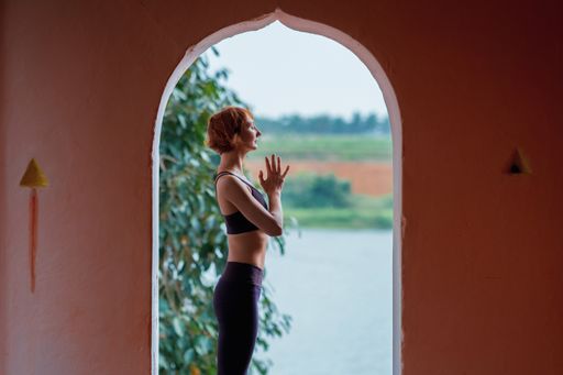 A ginger-haired Caucasian yogini in a Hindu temple in Mysore, India
