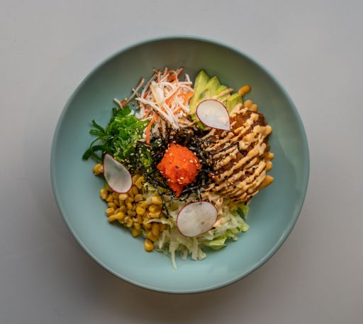 A top view shot of a dish on a blue plate in a restaurant