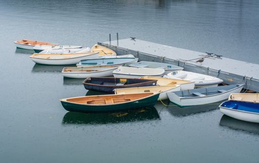 A beautiful shot of rowboats in the rain