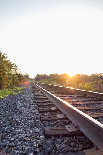 A vertical shot of an empty railway track during sunrise in London, Ontario
