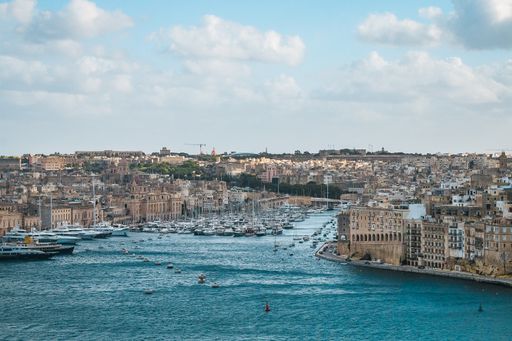 An aerial view of the beautiful island of Malta against blue cloudy sky in the morning