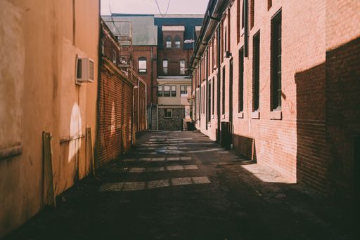 An old alley between buildings in sunny weather