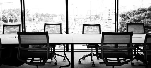 AA grayscale shot of an empty office meeting room