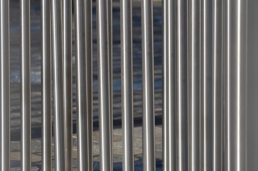 A closeup shot of metal poles concrete bars