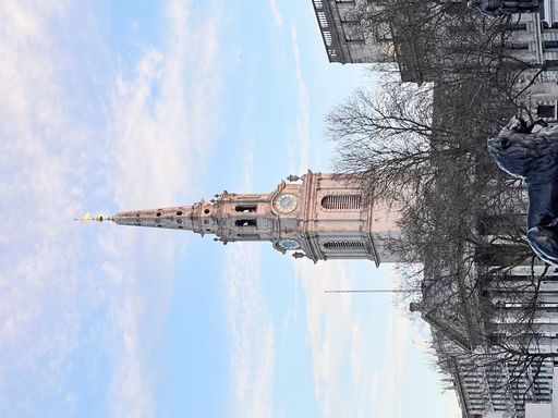 A vertical shot of St. Martin in the Fields church against a cloudy sky in Trafalgar Square, London