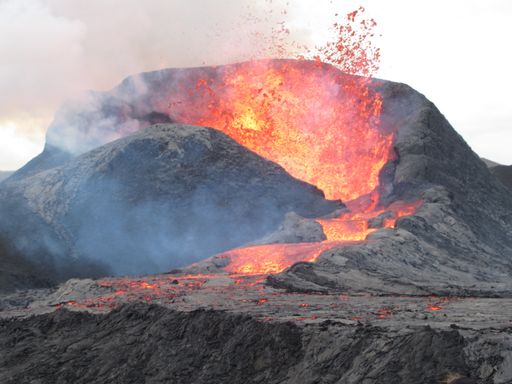 A shot of lava erupting at the volcano - Natural disaster