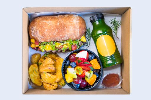 A top view of Georgian lunch box with, meat, potatoes and traditional sandwich