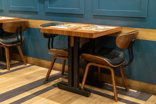 An empty small, cozy table and two chairs in good restaurant