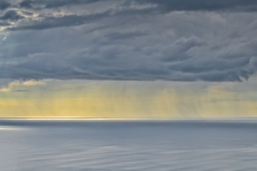 A landscape shot of a beautiful seascape under the blue sky