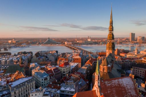 The aerial view of the Daugava river and old buildings in Riga, Latvia during sunset