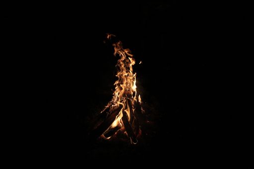 Fire flames in the dark with a black background