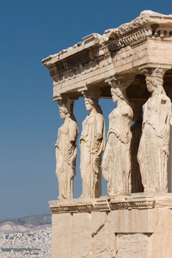 a Vertical shot of Four Caryatids erechtheum Acropolis in historical place of Athens , Greece