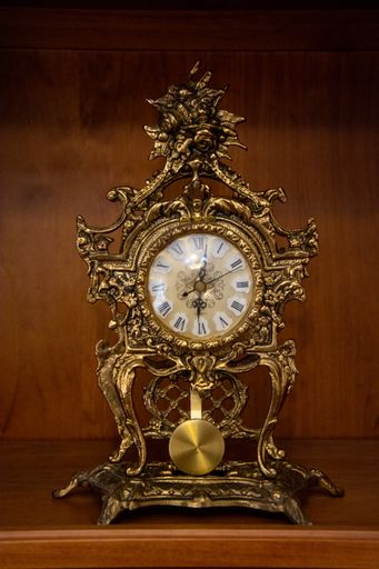 pendulum antique clock  metal gold