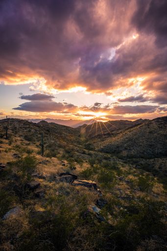 A beautiful view of Sunlight streams through the canyon on South Mountain in Phoenix, Arizona