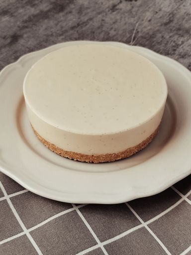 A close-up shot of a delicious homemade cheesecake on a white plate