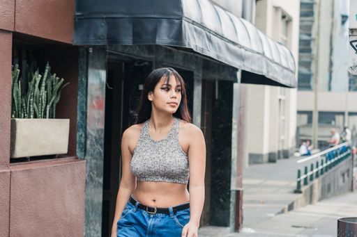 beautiful latina girl walking down the street.