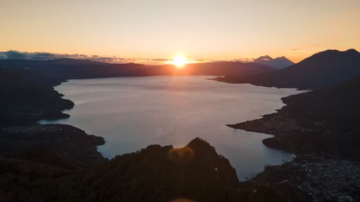 A beautiful landscape of lake Atitlan and mountains against dusk sky as it's seeing from Indian nose hike, Guatemala