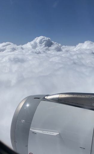 The view of the clouds and plane engine from the window