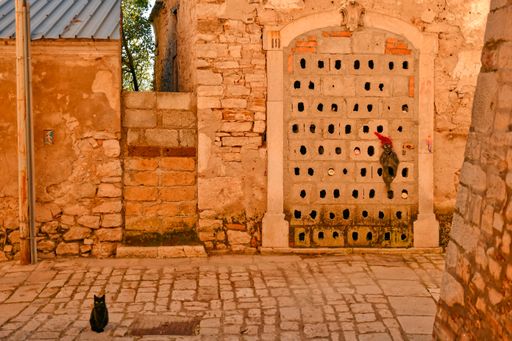 A cat and a ghost drawn on the wall of an old ruined house in Buonalbergo, a village rebuilt after an earthquake in the province of Benevento.