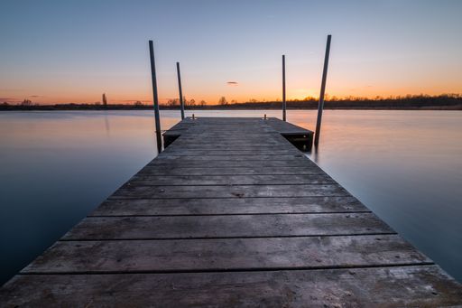 Jetty leading into the Giftener See at sunset near by hannover