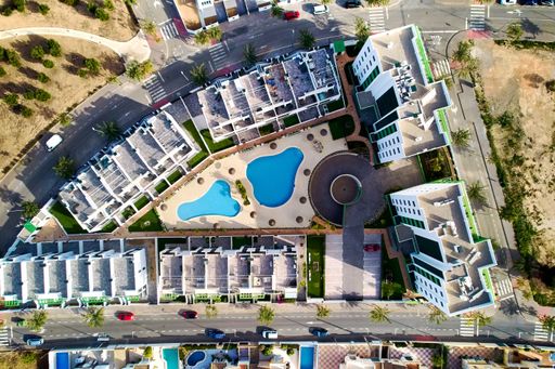 A bird's eye view of the residential houses on the coast in Mil Palmeras, Costa Blanca, Spain