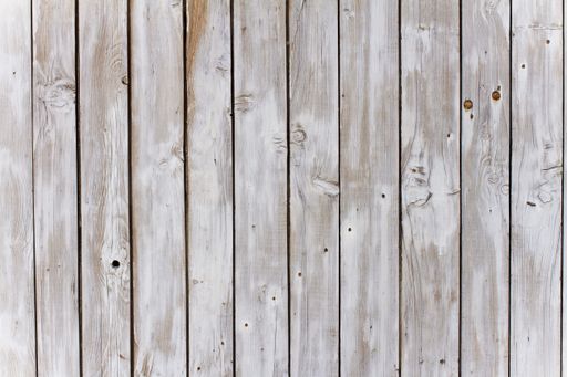 An old weathered gray wooden fence texture background