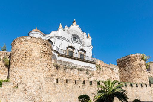 A low angle shot of the Episcopal Palace over the medieval walls of Plasencia in Caceres, Spain