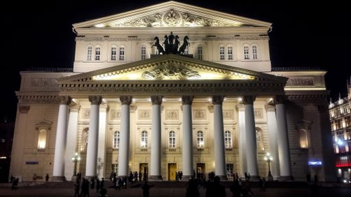 A wide shot of the building of Bolshoi Theater in Moscow, Russia during night