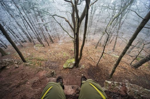 Me sitting on a rock in the frozen forest