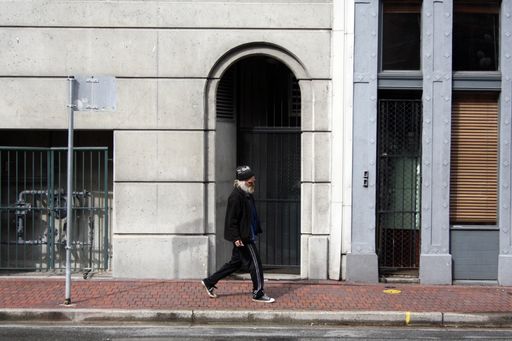 Man walking in the street of downtown Vancouver, British Columbia, Canada