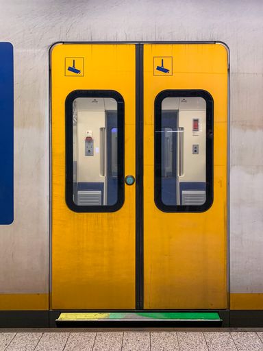 A vertical closeup shot of a metro doors in Amsterdam, Netherlands