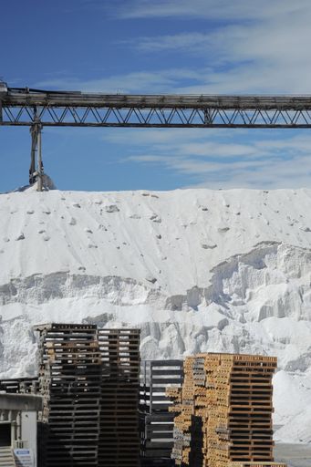 White heap or pile of salt granules (pellets) or phosphoric (phosphate) fertilizers on chemical plant. SeSalt industry